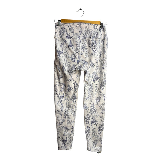 Calzas La Pichilemina de tiro alto con estampado botánico azul sobre fondo claro, ideales para yoga y entrenamiento.