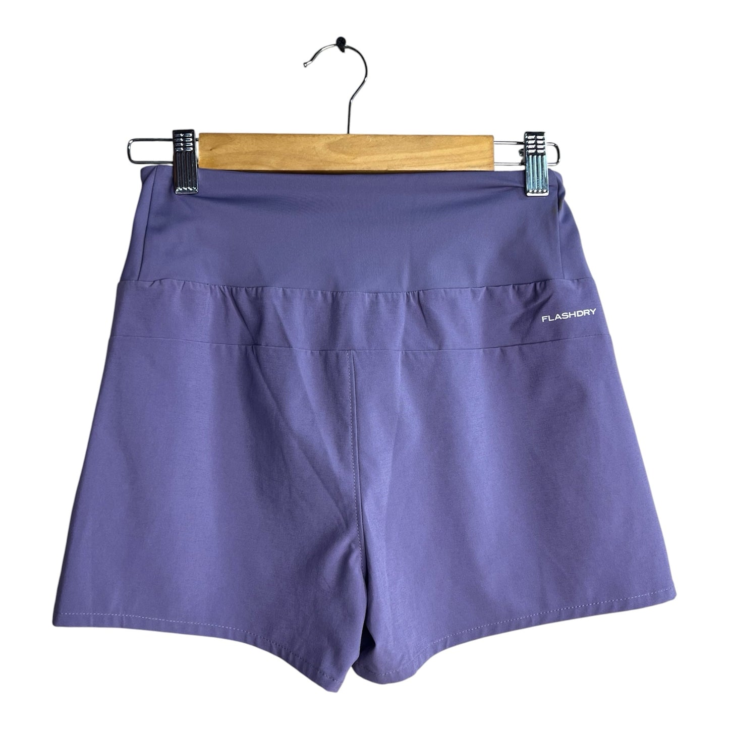 Short deportivo La Pichilemina color violeta de tiro alto con tecnología FlashDry para entrenamiento y running.